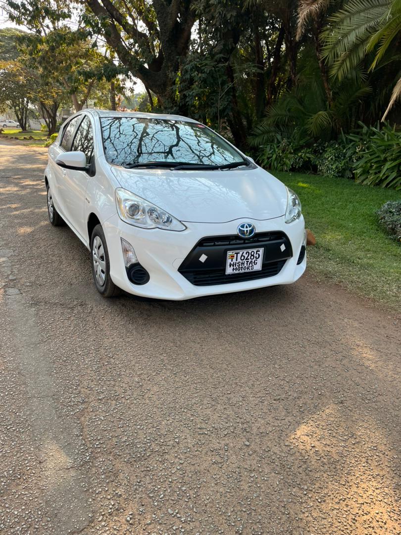 Toyota White  Aqua Blackface